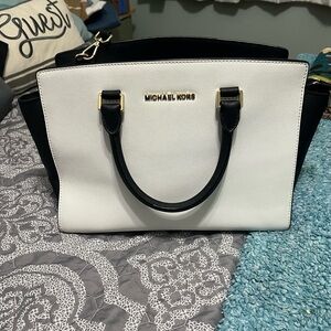 Black and white Michael Kors medium sized bag with cross body strap